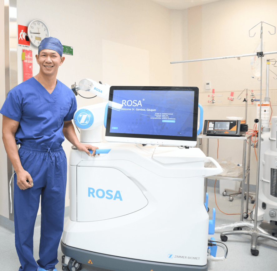 Dr Gamboa with ROSA robot (1).png